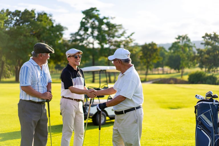 Group of Asian people businessman and senior CEO enjoy outdoor sport lifestyle golfing together at golf country club